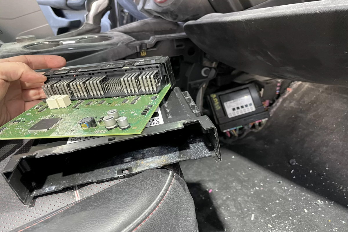 Microscopic circuit board repair on a failing Body Control Module by Auto Airbag & Electrical Specialist.